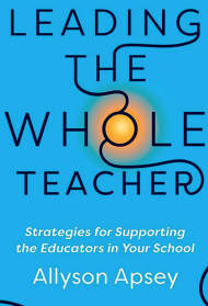 A blue book cover with the title "Leading the Whole Teacher"