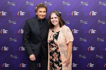 Musician Barry Manilow stands next to MSTA member Emily Witt