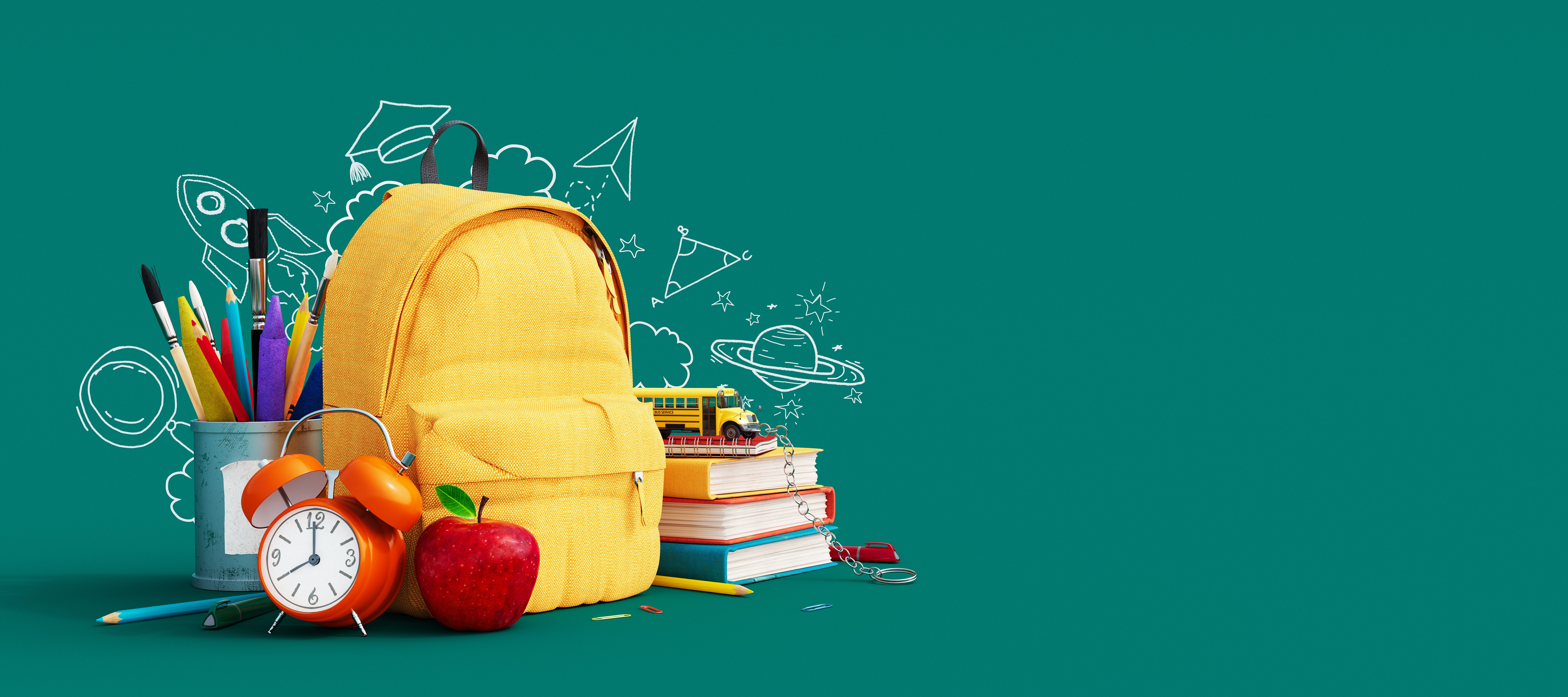 Yellow backpack surrounded by school supplies