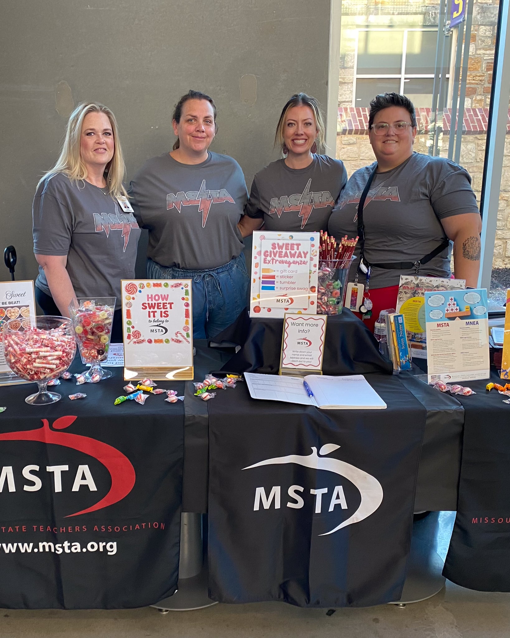Four women with shirts that say "MSTA"